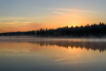 Fototapeta na wymiar lake sunrise fog peach