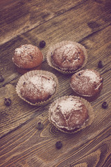 cupcake with berries on wooden background