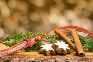 Christmas decoration with cookies, ribbon and bokeh background