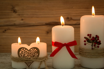 Fototapeta na wymiar Elegant candles decorated for Christmas