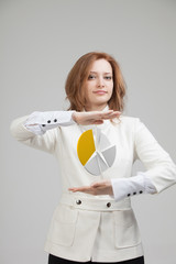 Woman shows a pie chart, circle diagram. Business analytics concept.