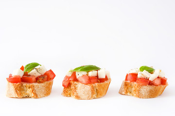 Caprese salad bruschettas isolated on white background

