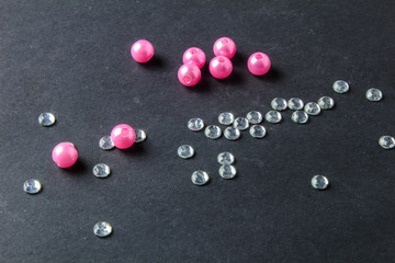 colorful beads and crystals on a black background