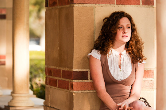 Unhappy depressed female woman girl student on college university campus