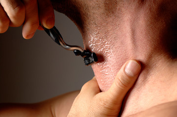 Close up man shaving with razor and gel on throat neck - obrazy, fototapety, plakaty