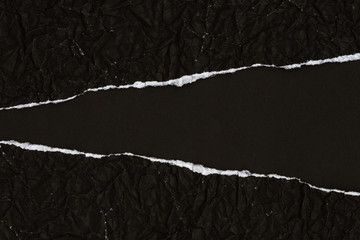 Ripped crumpled black paper with space - 123349405