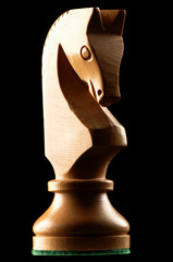 White knight horse chess piece on black