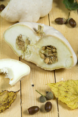 Patison with autumn leaves. Wooden boards. 