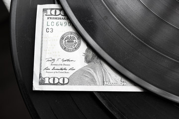 vinyl record with a dollars
