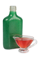 Green bottle and saucers on a white background