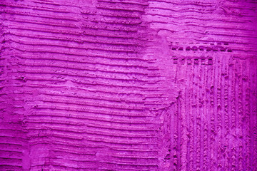 Pink textured cement wall