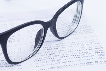 Finance Concepts, glasses with passbook as background