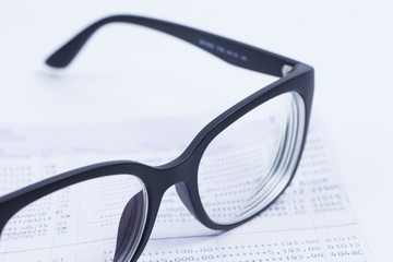 Finance Concepts, glasses with passbook as background