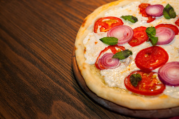 Pizza on wooden table