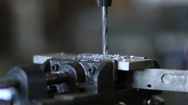 Drill tool in chuck during metal cutting process