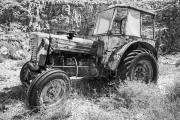Fototapeta na wymiar Old abandoned rusted tractor