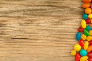 Obraz premium Colorful jelly beans shaped a frame to write your text