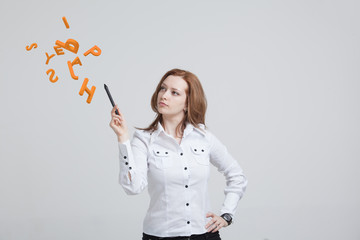 Woman working with a set of letters, writing concept.