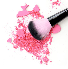 makeup brush products with crushed eyeshadow pink makeup.