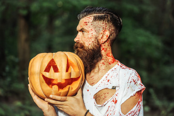 halloween man with pumpkin and blood