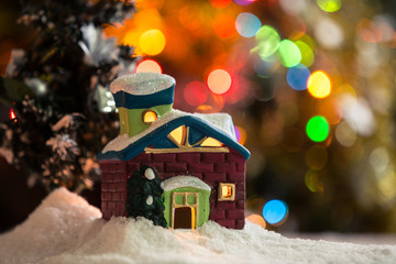 Naklejka premium Winter background. Christmas background. Christmas snowman and candles. Close-up. Night Photography.