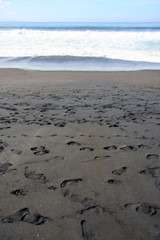 Komune beach resort Bali on the south-east coast of the island featuring black sand and waves