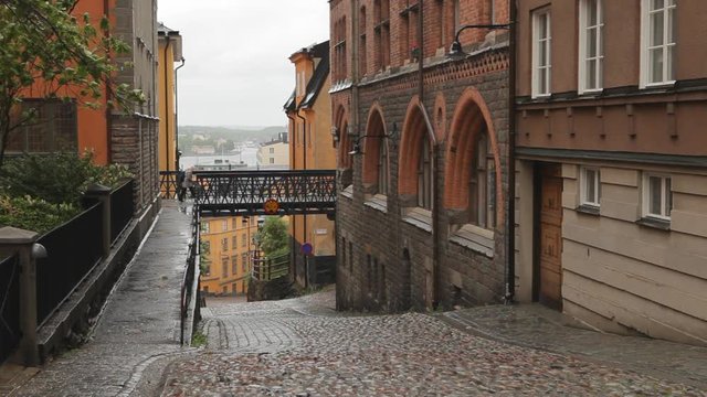 Pedestrian street in Gamla Stan, Stockholm, Sweden. Cobblestone and old buildings.