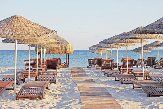 empty sunbeds on the beach 