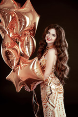 Party. Happy brunette girl with golden star balloons wears in el