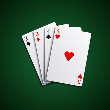 Four poker playing cards hand together