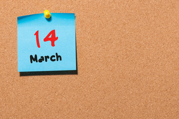 March 14th. Day 14 of month, calendar on cork notice board background. Spring time, empty space for text