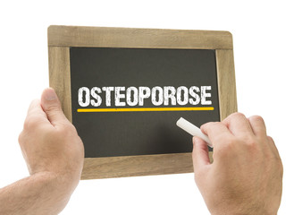 Osteoporose - Hand schreibt auf Kreidetafel