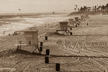 Sepia toned vintage concept of life guard towers on Huntington beach in southern California