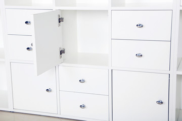 White wooden open boxes, white chest of drawers