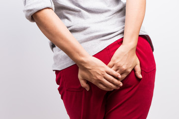 Woman has diarrhea and holding her butt