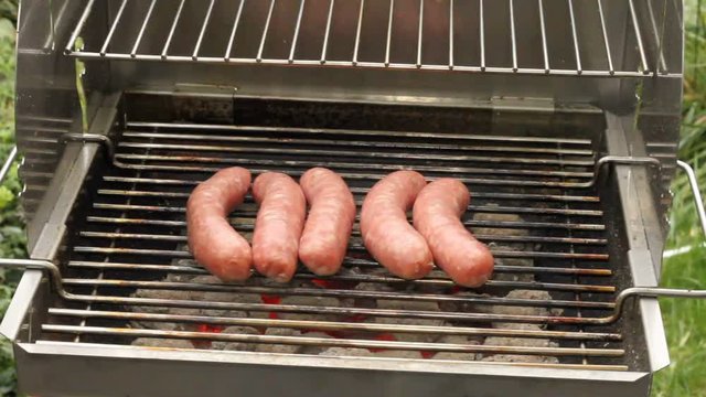Grilled sausages on a grill