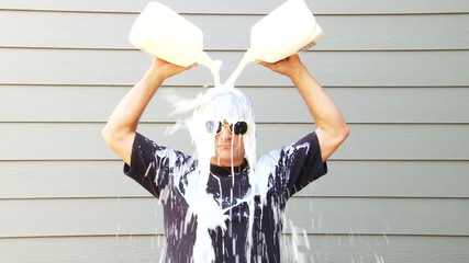 Got Milk anyone? Humorous clip of man pouring two gallons of milk over his head.