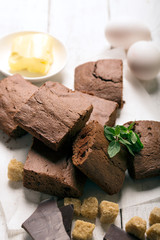 Chocolate brownie cake and ingredients of tart