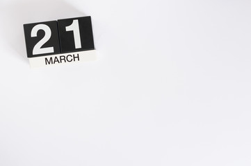 March 21st. Day 21 of month, wooden color calendar on white background. Spring time, empty space for text