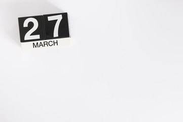 March 27th. Day 27 of month, wooden color calendar on white background. Spring time, empty space for text. World Theatre Days