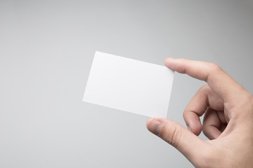 Hand holding business card