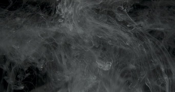 White Ink Effect In Water Filmed On Black Background. Abstract ink creating wonderfully unique cloud formations. Great for luma mattes or alien environments. Filmed in 4K for super Hi Def 
