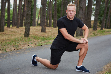 young athlete running in the forest