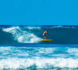 surfer in good waves in the caribbean
