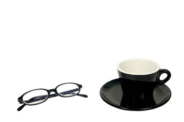 Eye glasses and black coffee cup on white background