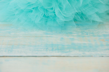 Background. Rustic turquoise straps with tulle on the top