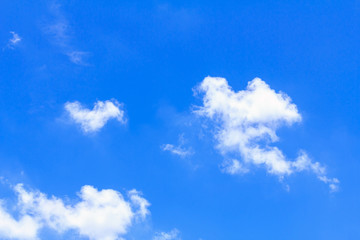 Blue sky background with white clouds. The vast blue sky and clouds sky on sunny day. White fluffy clouds in the blue sky.