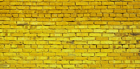 Yellow brick wall background, brick texture
