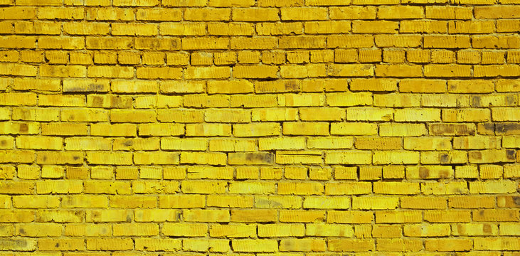 Yellow brick wall background, brick texture
