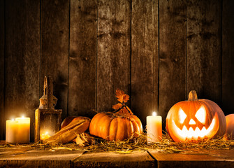 Scary halloween pumpkin on wooden planks
